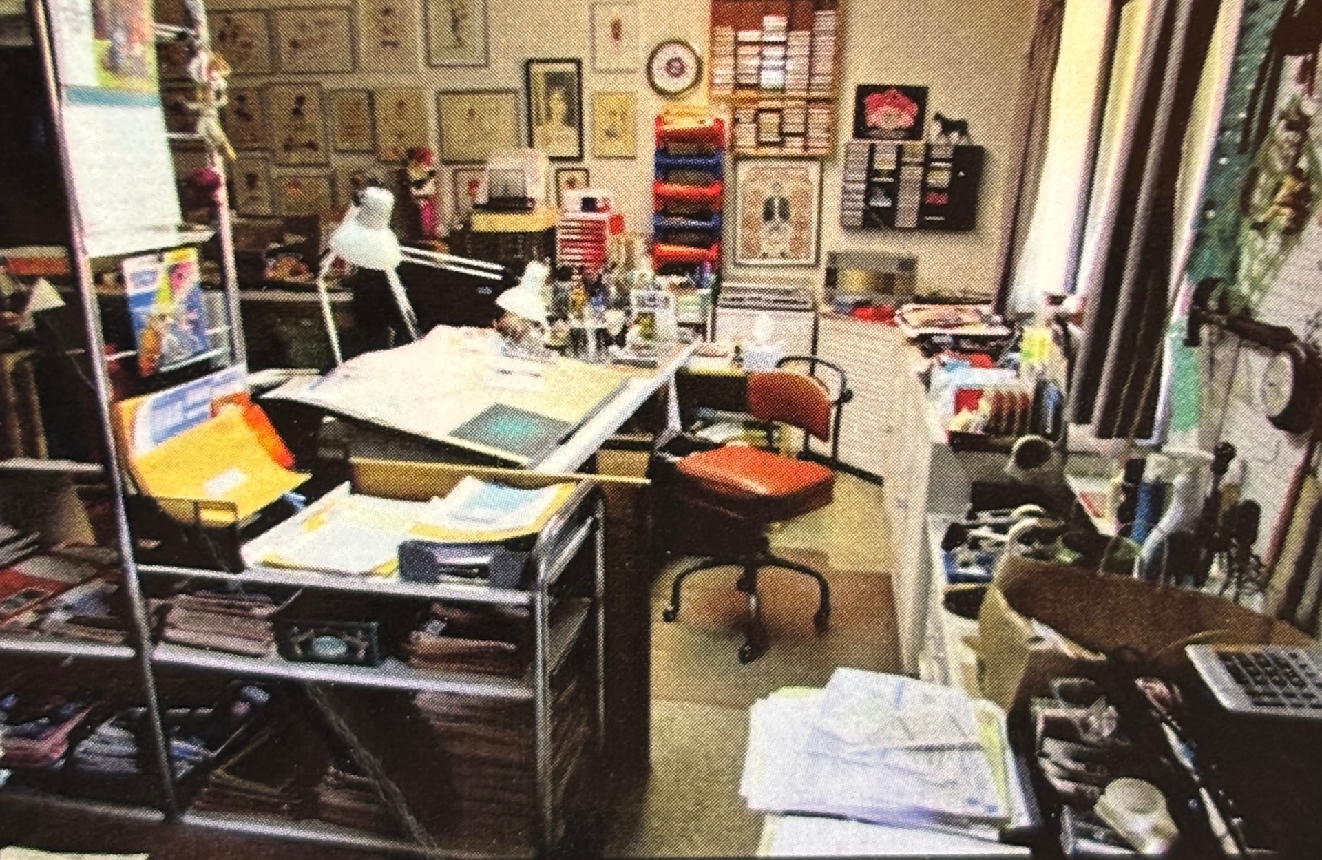 Jack's studio, walls covered in framed work
